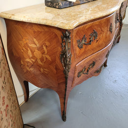 French Louis XV style marquetry inlaid two drawer marble top commode with deorative ormolu trim. In good original detailed condition with working double lock and key.
