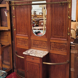 Attractive French Burr Walnut Hallstand. It has a single drawer, cupboard, brass rods, umbrella storage and a marble shelf. It is in good original condition. Please see photos as they form part of the description.
