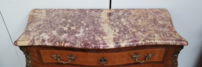 Walnut Louis XV style marble top abbattant with beautiful parquetry inlay and ormolu mounts. It has plenty of storage space with four large drawers and four smaller internal drawers. Beautiful drop down desk with a leather insert. In very good original detailed condition.