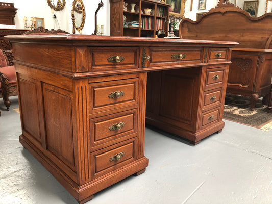 Antique french oak partners desk with plenty of drawers and cupboards and has an inbuilt Chubb Safe with keys. In very good condition.