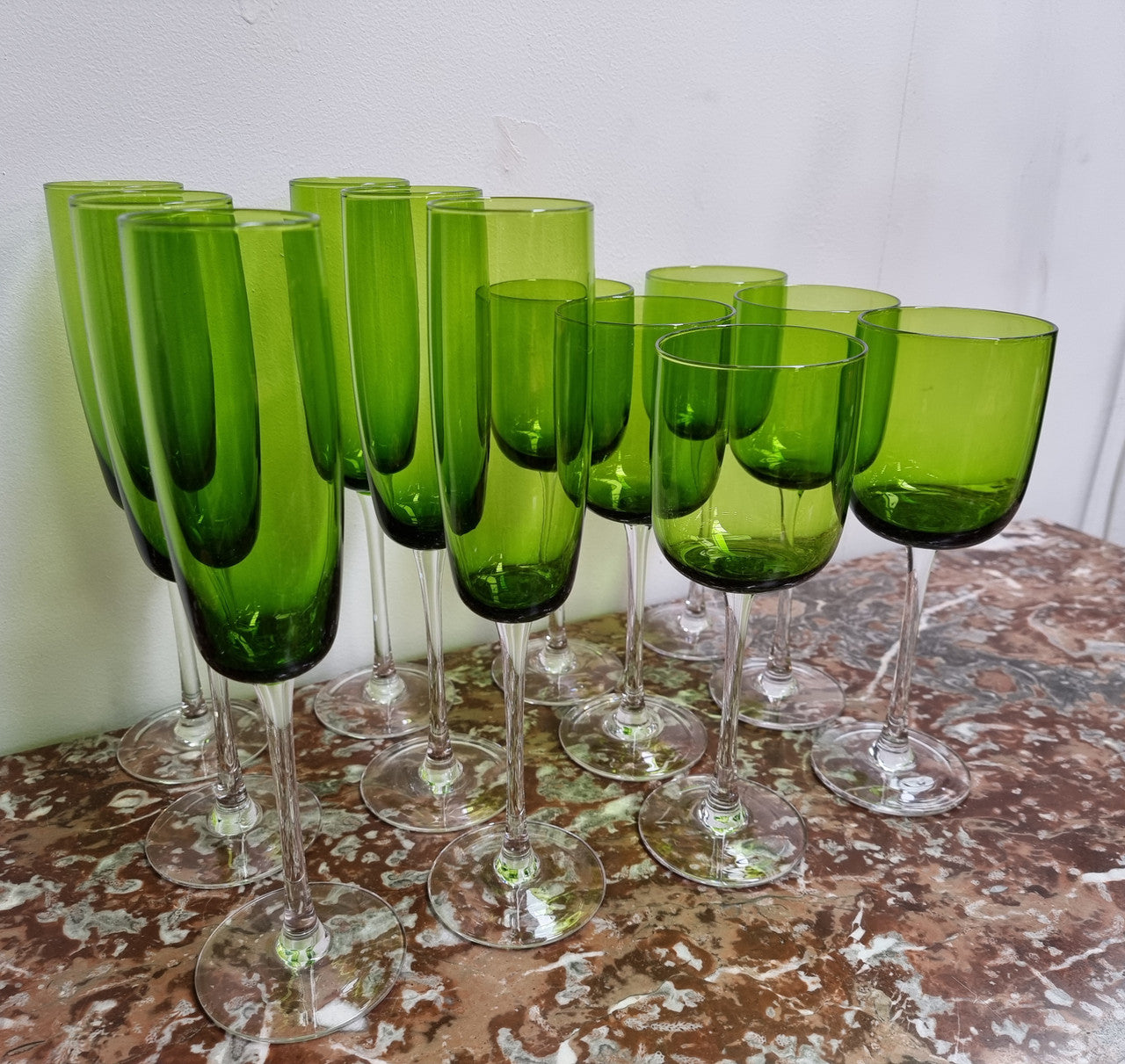 Beautiful set of 12 Vintage emerald green hand made wine glasses. Possibly Italian or French. They are in good original condition with no chips or cracks.