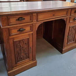 Lovely French Oak carved desk with four drawers and two cupboards. It is in good original detailed condition.