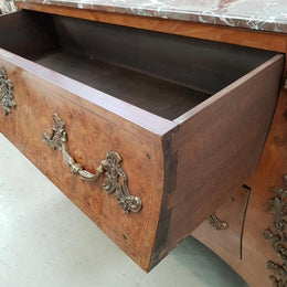 A large French Louis XV style Burr Walnut commode with a beautiful marble top. Has beautiful detailed mounts and plenty of storage space with two large drawers. From circa 1920 and in very good original condition.