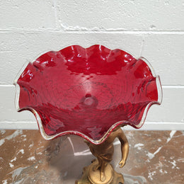 Late Victorian spelter table centerpiece/comfort featuring putti holding ruby glass bowl. In good original condition with no damage to the glass.