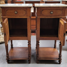 Antique French Oak Henry II white marble top bedside cabinets. They have one drawer and cupboard a long with an open shelf at the bottom. Sourced from France and in good original detailed condition.