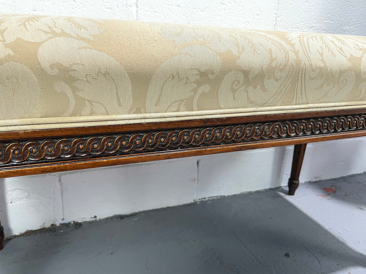Nicely carved French Louis XVI style Walnut upholstered stool. The stool is in good condition and the frabic is in good used condition, please view photos as they help form part of the description.