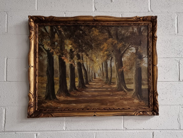 French signed oil on canvas depicting a charming landscape scene in a decorative gilt frame. It is in good original detailed condition and has been sourced from France.