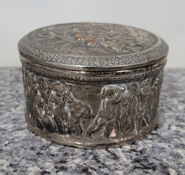 Unusual Antique silver over pottery Italian trinket box nicely decorated with Cherubs. It is in good original condition, please view photos as they help form part of the description.