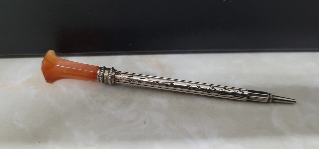 Attractive sterling silver and onyx propelling pencil. In good original condition, please view photos as they help form part of the description.