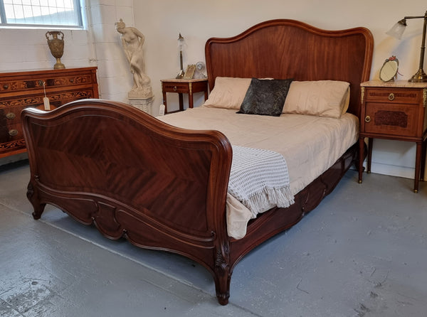 Beautiful French Walnut Louis XV style queen size bed with carving on the feet and in good original detailed condition.