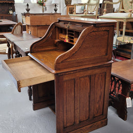 Charming petite English Oak fitted roll top desk. It has a very lovely fitted interior and a drawer at the front ideal for a unit or apartment. Sourced locally and in good original detailed condition.