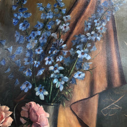 An Antique gilt-framed oil painting of floral still life. Housed in a double sweep gilt frame, signed and dated in good condition.