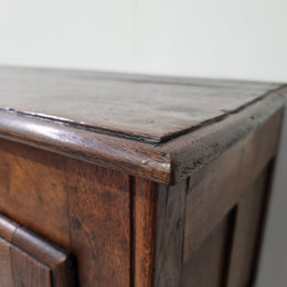 A charming French Oak early 18th Century two door sideboard. Plenty of storage space with two fixed shelves either side. It is in good original detailed condition for its age and comes with  a working key and working locks.