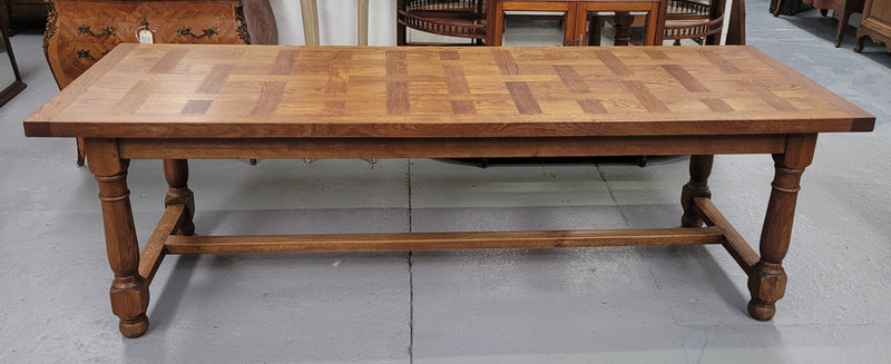 French Oak Refectory dining table with a parquetry top. Sourced from France this table comfortably sits eight to ten. It is in good original detailed condition.