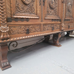 Large French Oak Renaissance style four door sideboard/buffet. Great decorative item with amazing carvings and stunning iron work on base. It is in good original detailed condition. Can pull apart completely making it easier to move.