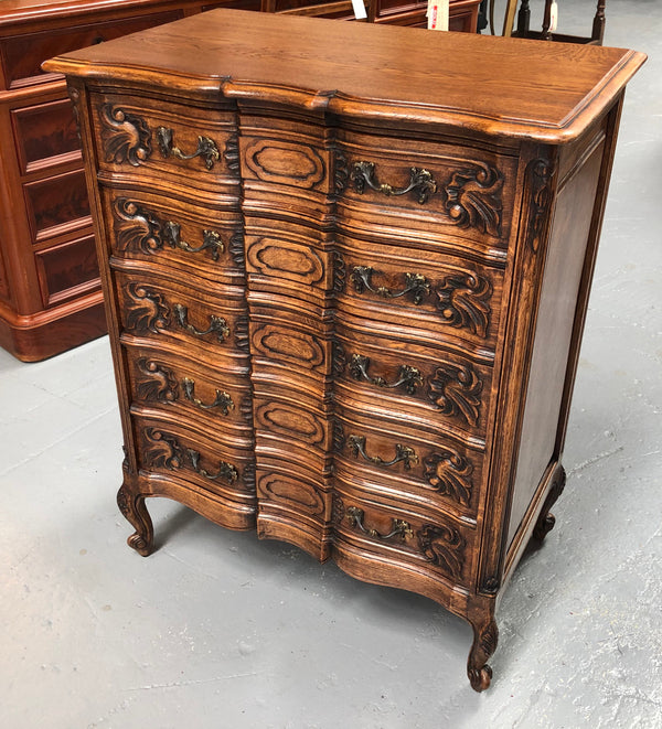 French Oak miniature chest of five drawers with serpentine shaped front. In very good original detailed condition.