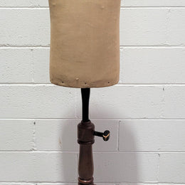 Vintage fabric covered child mannequin on adjustable wooden base. In good original condition.