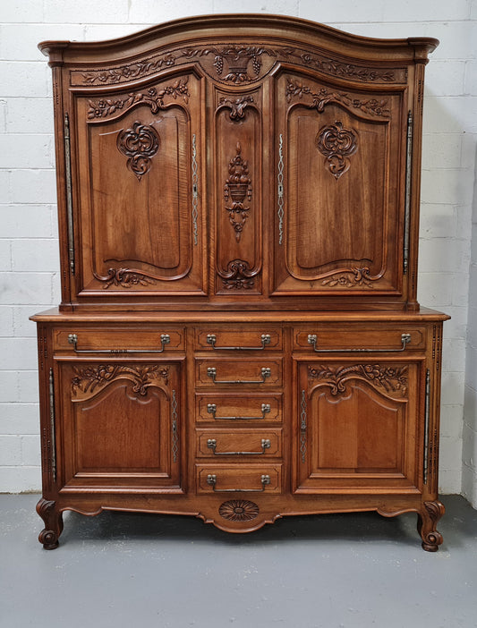 Beautiful 19th century Walnut Louis XV style sideboard with plenty of storage space. The top has two doors that open up to three adjustable shelves. It is in good original detailed condition.