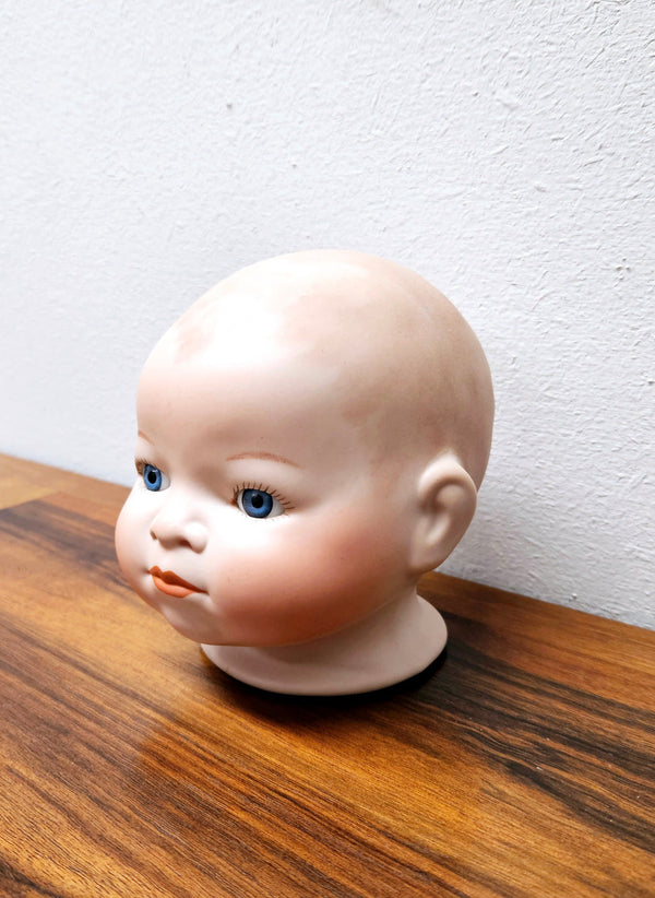 Large Bisque Dolls Head with beautiful blue eyes.  Marked on the back of the neck "Copy By Grace S utnam Made in Germany"  no chips or cracks please see photos as they form part of the description.