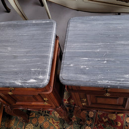 Pair of Walnut Louis XV style grey marble top bedside cabinets. Single drawer, one cupboard and lovely French cabriole legs. They have been sourced from France and are in good original condition.