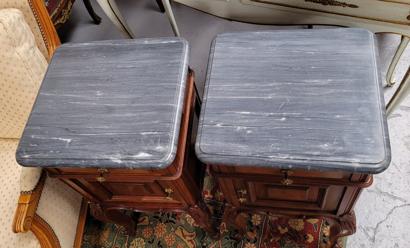 Pair of Walnut Louis XV style grey marble top bedside cabinets. Single drawer, one cupboard and lovely French cabriole legs. They have been sourced from France and are in good original condition.
