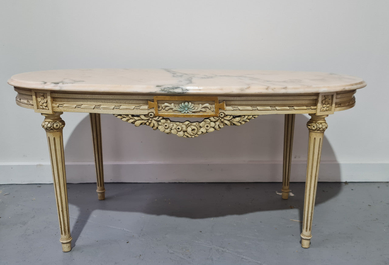 Charming painted Louis XVI style oval marble top coffee table. In good original detailed condition.