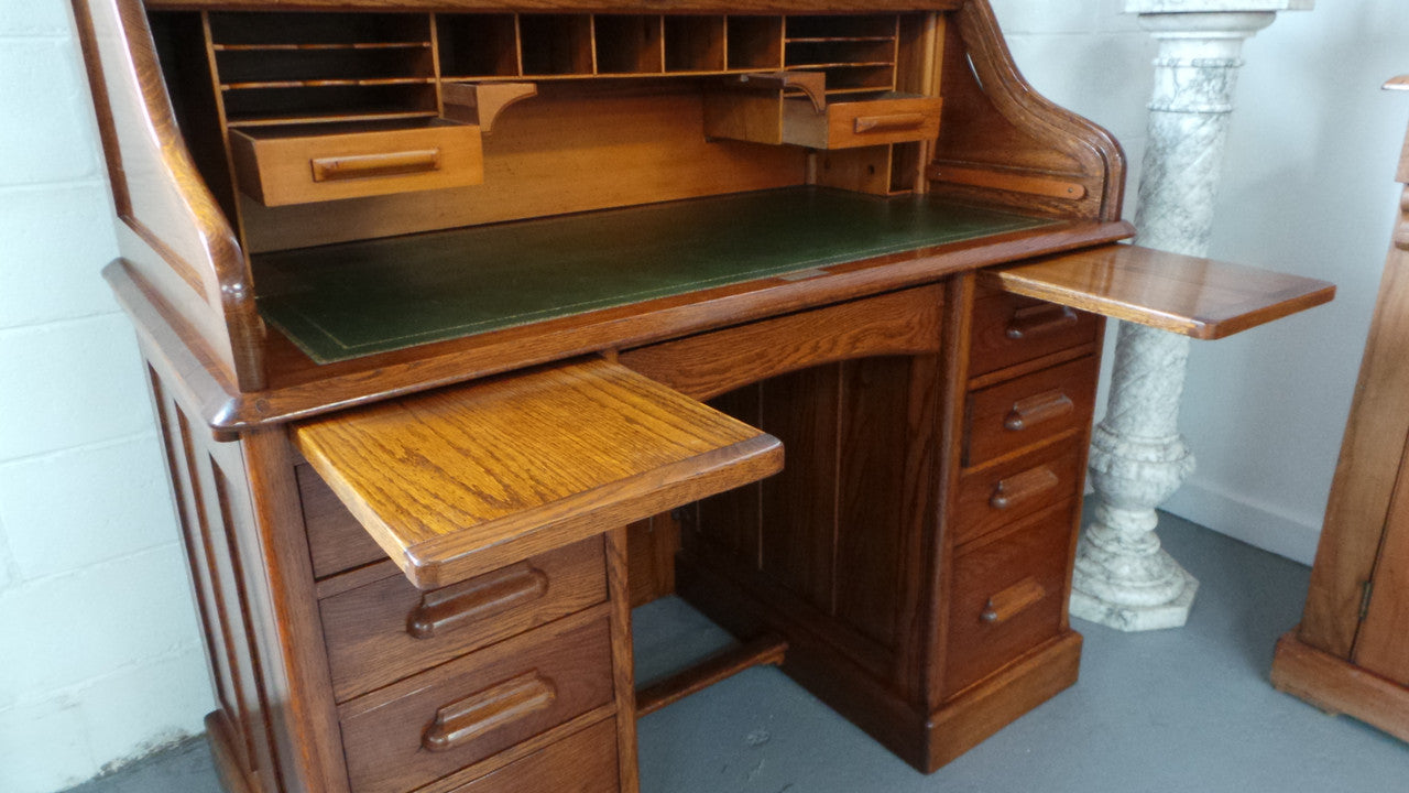 An Antique English Oak Roll Top Desk