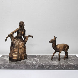 Art Deco gilt metal lady and deer statue on a lovely grey marble base. It has been sourced from France and is in good original condition. The marble does have some minor chips and wear due to age, please view photos as they help form part of the description. Please contact us if you would like additional photos.