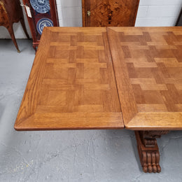 Amazing French Oak Renaissance style parquetry top extension table. Beautiful parquetry top and amazing detailed carvings on the legs. It extends to 306 cm long when fully extended. Sourced from France and in good original detailed condition.