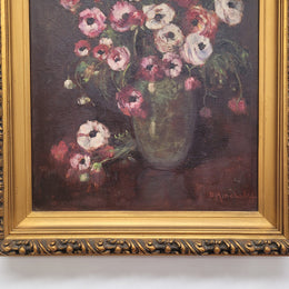 Antique French floral oil on canvas in gilt frame that is signed lower right corner. It has been sourced from France and is in good original detailed condition.