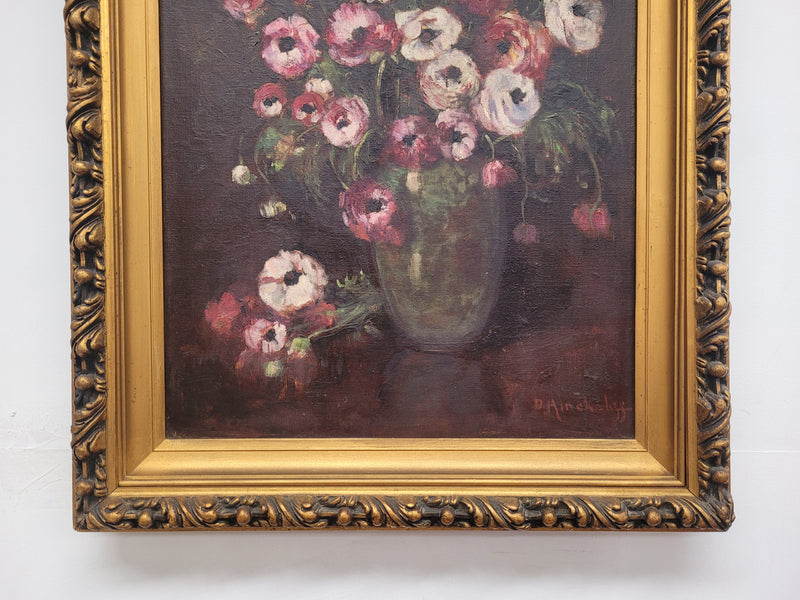 Antique French floral oil on canvas in gilt frame that is signed lower right corner. It has been sourced from France and is in good original detailed condition.