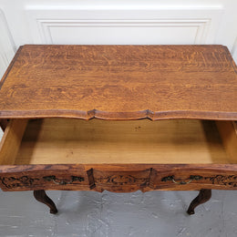 Vintage French dark Oak Louis XV style chest of three drawers. It has beautiful cabriole legs, elegant brass handles and decorative carving throughout. It is in good original detailed condition and has been sourced from France.