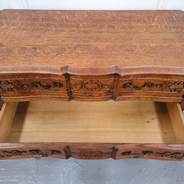 Vintage French dark Oak Louis XV style chest of three drawers. It has beautiful cabriole legs, elegant brass handles and decorative carving throughout. It is in good original detailed condition and has been sourced from France.