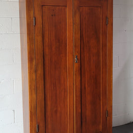 Australian Victorian Pine storage cupboard of pleasing narrow portions. Heaps of storage space and is in very good original detailed condition.