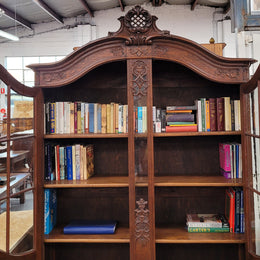 Substantial French Oak Louis 15th Style large two door bookcase. Adjustable shelves and very decorative carving. In good original detailed condition.