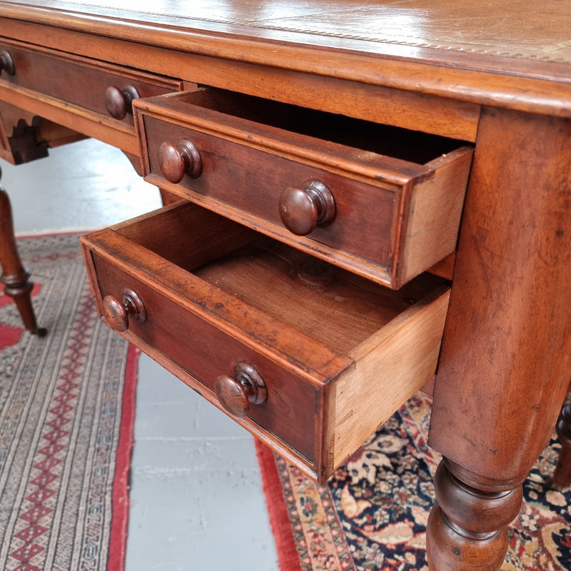 Lovely Victorian Cedar leather tooled  top desk, with five drawers on castors and of pleasing proportions. In very good original detailed condition and has been sourced locally.