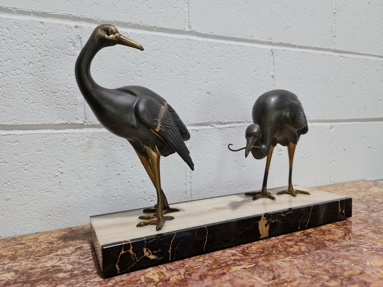 Fabulous French Art Deco cold painted spelter Ibis birds on a stylized Art Deco marble base. Signed "Rochard" circa 1930's. In good original detailed condition.