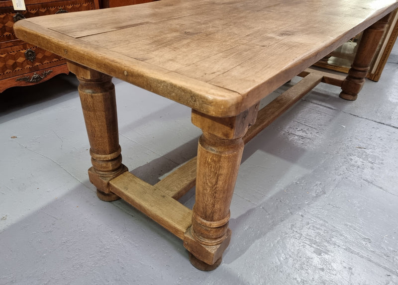 French Oak stretcher base farmhouse table with solid turned legs. It is in good original condition.