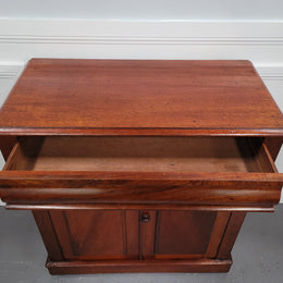 Cedar side cabinet with two doors one drawer and lovely door panels and corbels. It has been sourced locally and is in good original detailed condition.