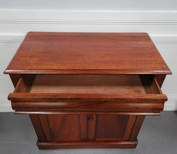 Cedar side cabinet with two doors one drawer and lovely door panels and corbels. It has been sourced locally and is in good original detailed condition.