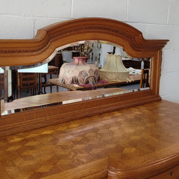 Beautiful French Oak Louis XVI Style nicely carved sideboard with a lovely parquetry top and mirror. It has five drawers and three cupboards for all your storage needs. In good original detailed condition.