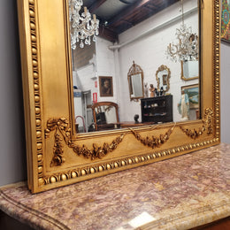 Stunning Vintage French floral gilt framed overmantel mirror. It has been sourced from France and is in good original detailed condition.