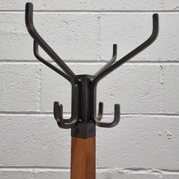 Very sturdy Industrial Queensland maple coat stand on a circular solid base. In good original condition.