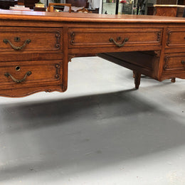 French Oak Louis XV style full partners desk with both sides having five functional drawers. In very good original detailed condition.