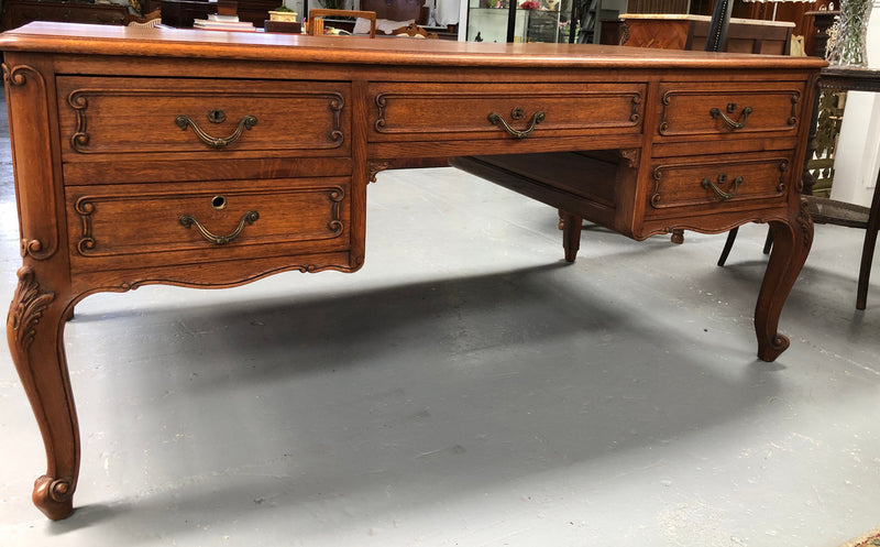 French Oak Louis XV style full partners desk with both sides having five functional drawers. In very good original detailed condition.