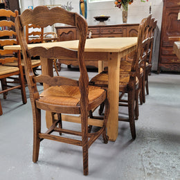 French raw Oak stretcher based refectory table. Features raw wood that could be used as is for a distressed look, or finished and waxed for a more refined look. Sourced from France and in good original condition.