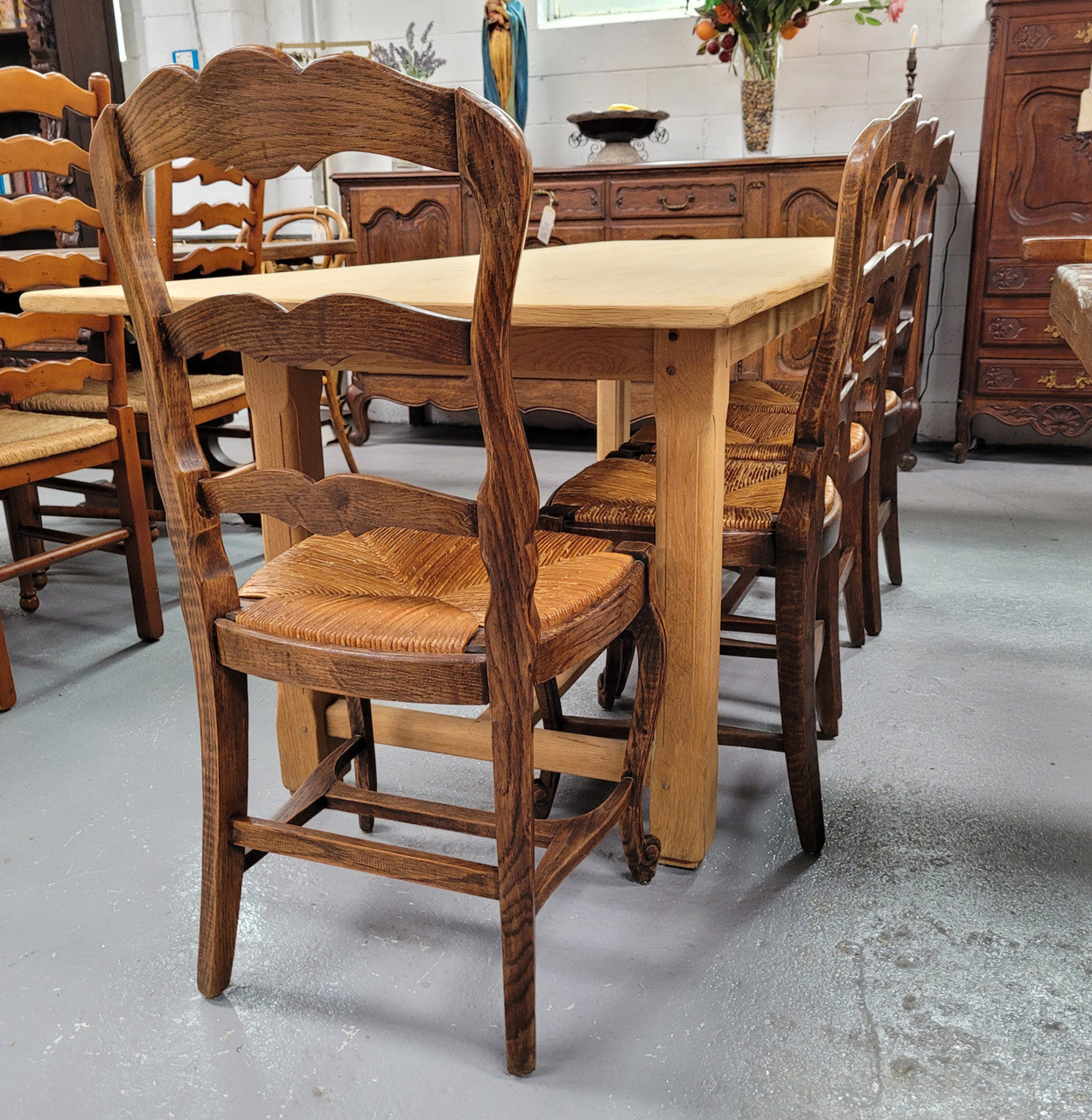 French raw Oak stretcher based refectory table. Features raw wood that could be used as is for a distressed look, or finished and waxed for a more refined look. Sourced from France and in good original condition.