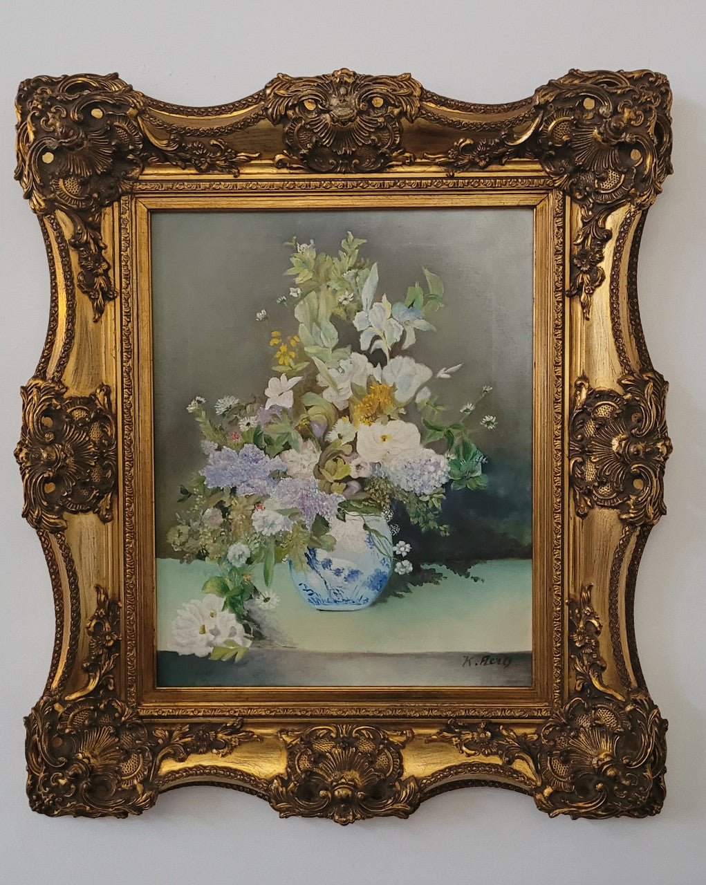 Stunning gilt frame with signed oil on canvas depicting floral arrangement in vase. In good original detailed condition.