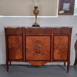 A high quality 19th Century French marquetry inlaid Kingwood marble top credenza. It has an attractive solid marble top and decorative marquetry inlay throughout. It has plenty of storage space with three drawers and three doors. It has been sourced from France and is in good original detailed condition.