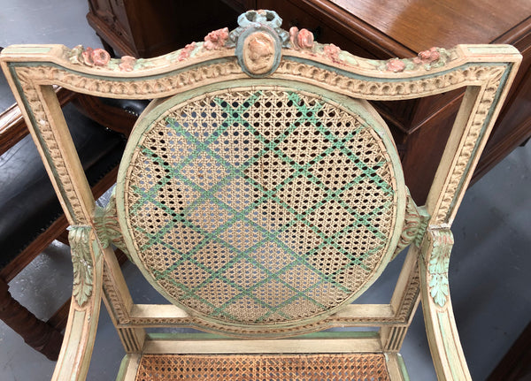 Painted French Louis XVI style cane panel arm chair. Paint is original and it is in very good original condition.